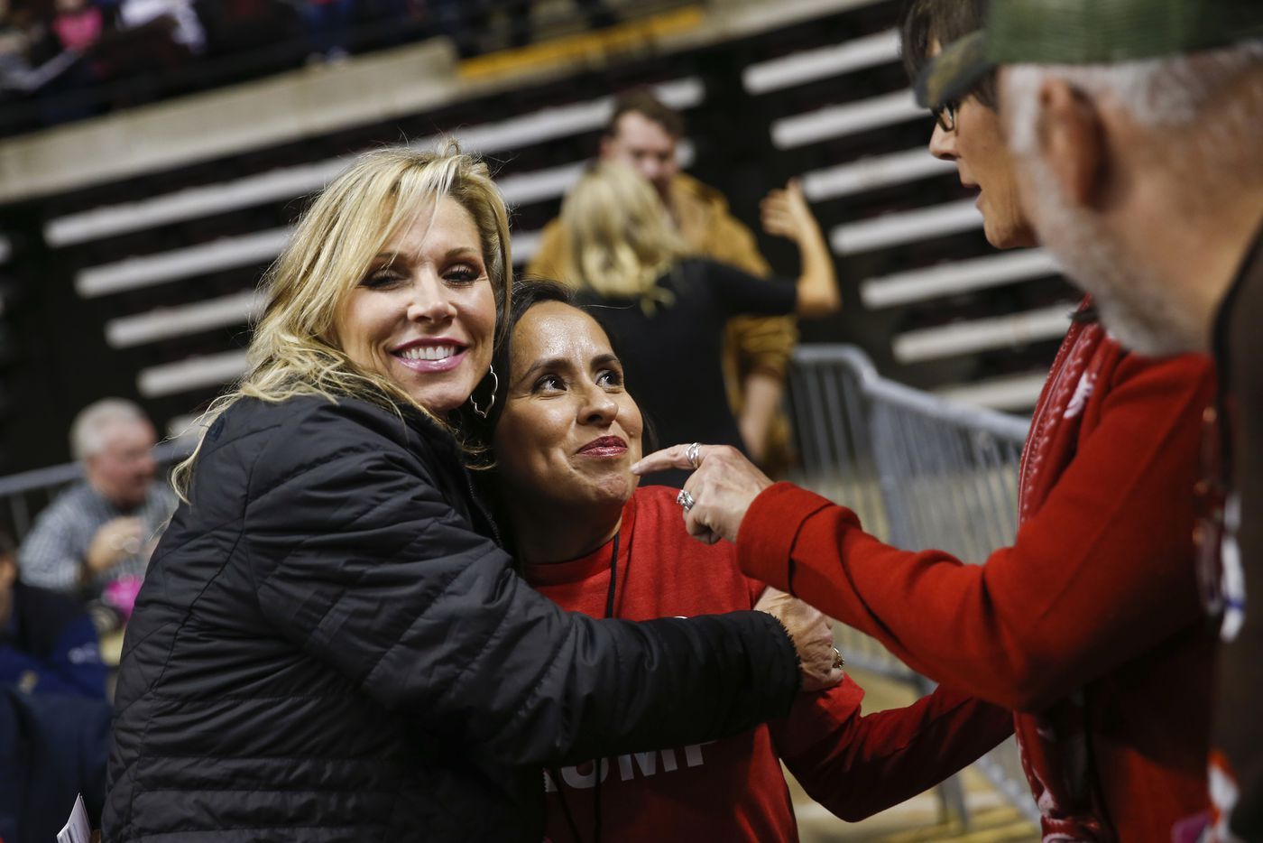 Teri Netterville (left) of KEEL 710 AM radio embraces Martha Doss, who gave an interview to the station during a rally to reelect President Donald Trump in Bossier City, La., on Nov. 14, 2019.