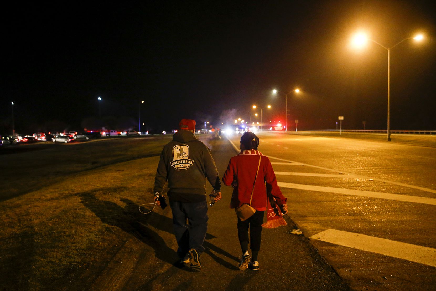 After a nearly 18-hour day, Martha Doss and her husband, Wesley, searched for their Uber driver to leave a rally to reelect President Donald Trump in Bossier City, La., on Nov. 14, 2019.