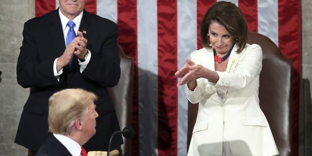 President Donald Trump turns to House Speaker Nancy Pelosi of Calif., as he delivers his State of the Union address to a joint session of Congress on Capitol Hill in Washington, as Vice President Mike Pence watches, on Feb. 5, 2019. (AP Photo/Andrew Harnik)