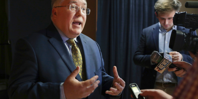 FILE - In this Nov. 1, 2018, file photo, Patrick Morrisey speaks to reporters after a debate in Morgantown, W.Va. (AP Photo/Raymond Thompson, File)