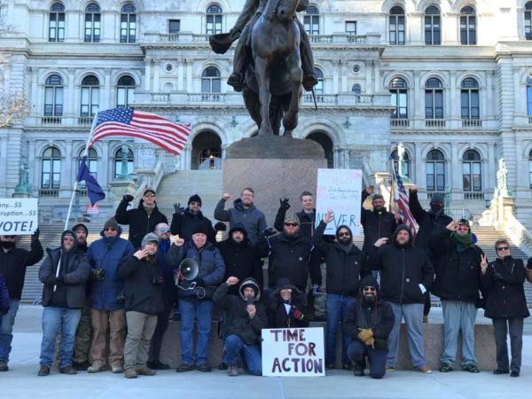 An event that includes a photo of so-called "Three Percenters" flashing a hand gesture that has been linked with white supremacist groups has been posted on a Facebook group promoting opposition to new criminal justice reforms. An event that includes a photo of so-called "Three Percenters" flashing a hand gesture that has been linked with white supremacist groups has been posted on a Facebook group promoting opposition to new criminal justice reforms.