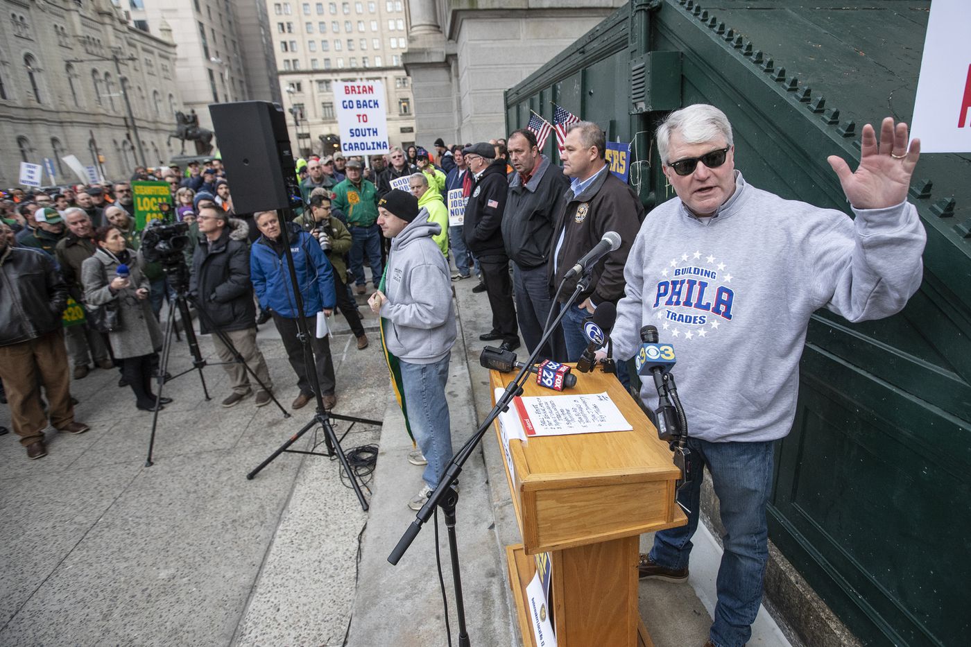 John Dougherty (right) head of IBEW Local 98, addresses building trades union members at City Hall on last month.