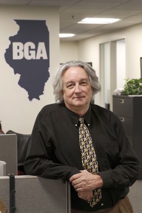 In this Monday, March 9, 2020, photo, David Kidwell, special projects editor with the Better Government Association, poses for a portrait at his office office in Chicago. Political misinformation is often considered a national and international challenge, in part because of the Russian-based trolls and bots who spread false claims and sowed division in a bid to influence the 2016 U.S. election. It's increasingly a problem on Main Street, too, as local candidates and politicians adopt misinformation tactics and local news organizations shrink or shut down, leaving residents with fewer credible sources of information. (AP Photo/Charles Rex Arbogast)