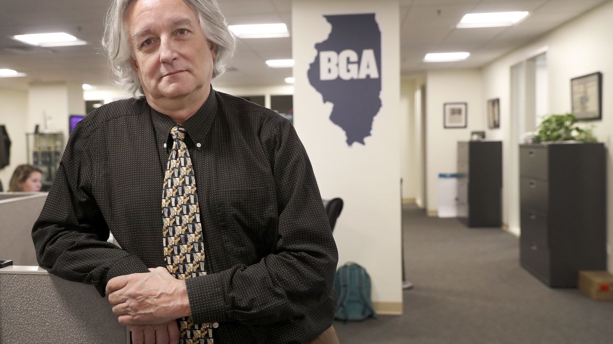 In this Monday, March 9, 2020, photo, David Kidwell, special projects editor with the Better Government Association, poses for a portrait at his office office in Chicago. Political misinformation is often considered a national and international challenge, in part because of the Russian-based trolls and bots who spread false claims and sowed division in a bid to influence the 2016 U.S. election. It's increasingly a problem on Main Street, too, as local candidates and politicians adopt misinformation tactics and local news organizations shrink or shut down, leaving residents with fewer credible sources of information. (AP Photo/Charles Rex Arbogast)