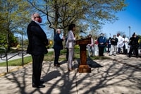 Image: Maryland Gov. Larry Hogan (R), left, at an April 22 news conference at Laurel Medical Center in Laurel, Md.