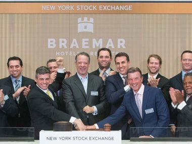 Dallas hotel executive Monty Bennett (center) rang the closing bell at the New York Stock Exchange in 2018 for one of the hotel real estate investment trusts that he chairs.