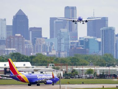 A Southwest Airlines 737 lands at Dallas Love Field on Tuesday, April 14, 2020, in Dallas. (Smiley N. Pool/The Dallas Morning News)