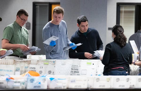Wisconsin election workers sorting absentee ballots for the April 7 primary. Democrats nationwide are trying to replicate the success in Wisconsin’s outreach operation and mail-in efforts.