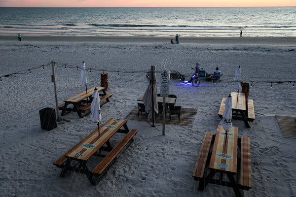 Empty tables at a restaurant in Florida last week. Senator Rick Scott of Florida argued against sending aid to states.