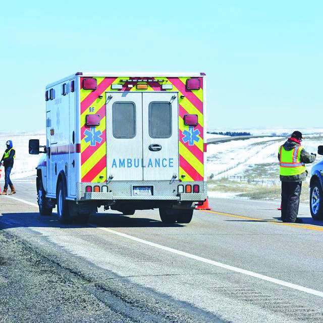 An ambulance is waved immediately through a highway checkpoint operated by the Cheyenne River Sioux Tribe. Tribal leaders say the checkpoints help control the flow of people onto and off of the reservation and gather critical health information to maintain the safety of residents on the reservation amid the COVID-19 pandemic.
