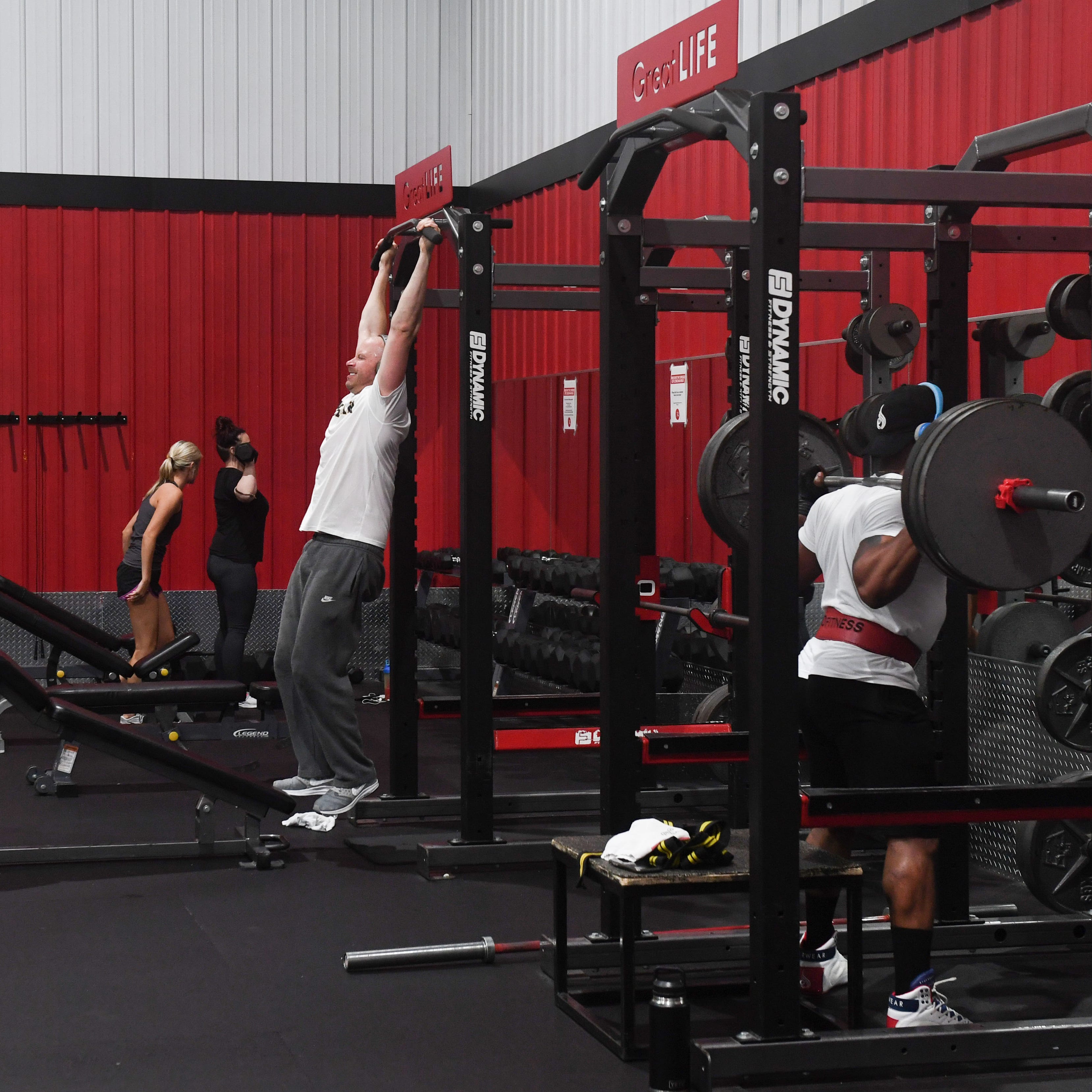 Gym goers work out on Tuesday, May 26, at GreatLife at 39th and Phillips in Sioux Falls. 