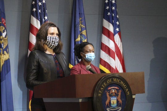 Gov. Gretchen Whitmer and Michigan Health and Human Services Chief Medical Executive Dr. Joneigh Khaldun wearing masks during a coronavirus news conference Friday, May 1, 2020.