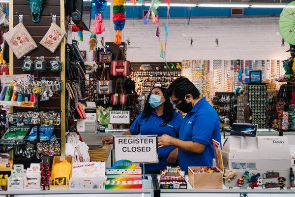 Employees worked at a gift shop in San Antonio on the day Gov. Greg Abbott lifted Texas&rsquo; stay-at-home order. 