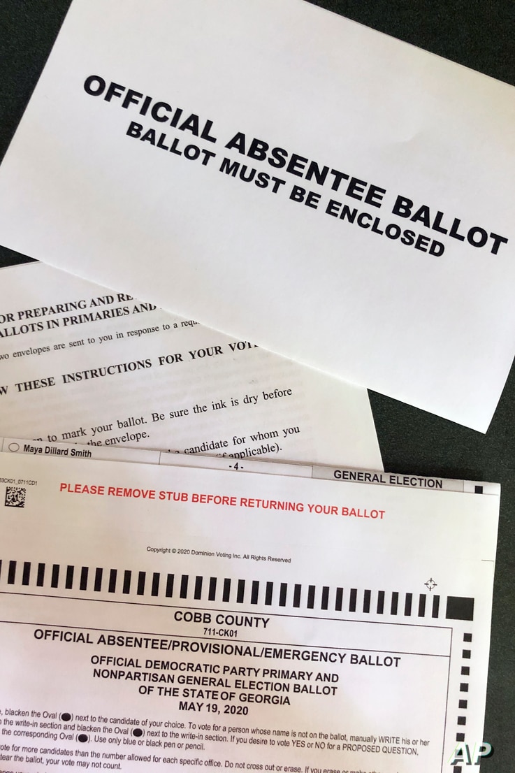 A Cobb County Ga., absentee ballot is seen Tuesday, May 5, 2020, in Kennesaw, Ga. Presidential Preference Primary, General…