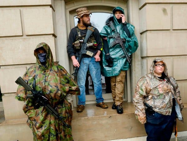 Armed protestors outside the Michigan State Capitol in Lansing. Mr. Trump has pressed states to reopen their economies.