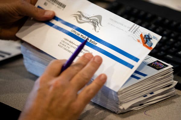 Early mail-in ballots were processed at the Chester County voter services office in West Chester, Pa., on Thursday.