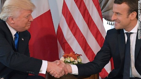 Donald Trump and Emmanuel Macron shake hands ahead of a working lunch on the sidelines of the NATO summit in Brussels, on May 25, 2017.