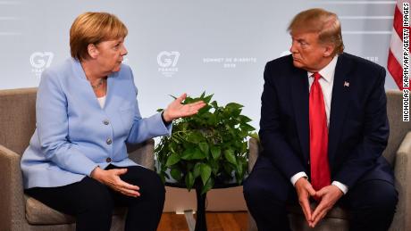 Trump showed shocking disdain for his peers: German Chancellor Angela Merkel speaks with the President during a bilateral meeting in Biarritz, south-west France on August 26, 2019, at the G7 Summit. 
