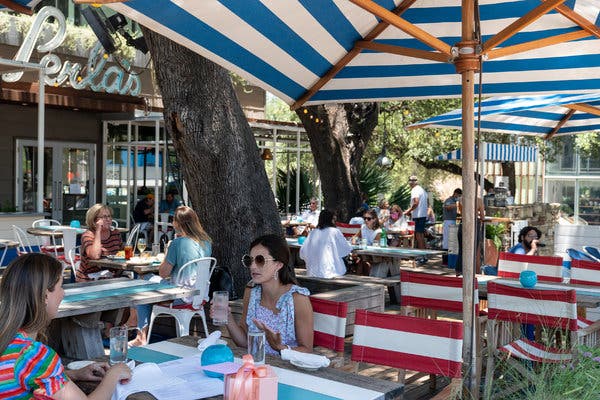 A restaurant in Austin on Wednesday. Mayors from Texas’ largest cities wrote a letter to the governor asking for the authority to require residents to wear masks in public.