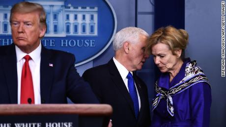 Dr. Birx listens to Vice President Mike Pence, during a briefing at the White House on March 18.