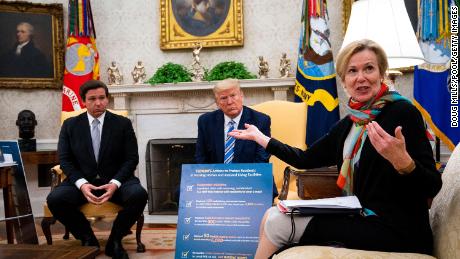 Dr. Birx answers a question while meeting with Florida Gov. Ron DeSantis and President Donald Trump in the Oval Office on April 28.