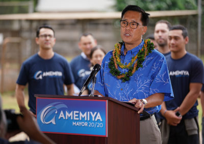 Keith Amemiya announces his candidacy for the office of Mayor at Ala Wai Field with his family and supporters.
