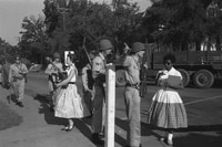 Image: Elizabeth Eckford, right, is turned away by Arkansas National Guardsmen as she approaches Little Rock Central High School on Sept. 4, 1957. The guardsmen were instructed by Gov. Orval Faubus (D) not to allow nine black students to enter the school, despite federal court orders.