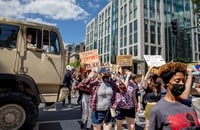 Image: Protesters march to the White House down 16th Street NW on June 7.