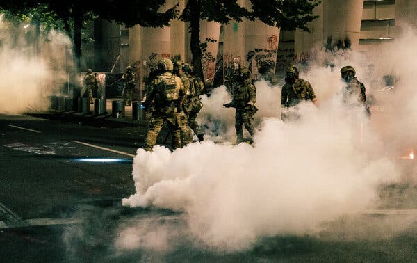 Federal law enforcement agents on Saturday in Portland, Ore.