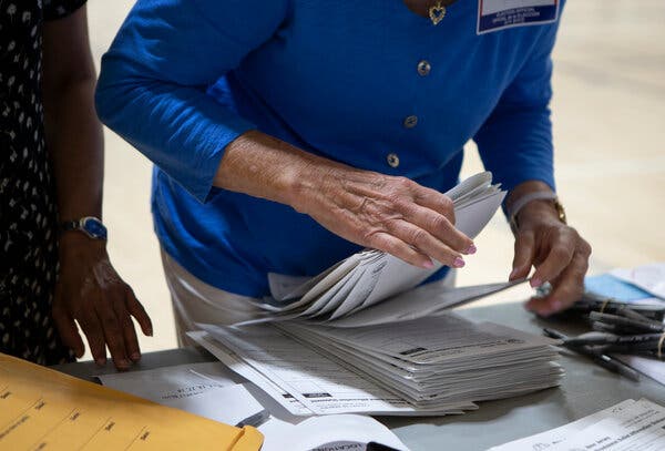 A poll worker counted provisional ballots for the New Jersey primary on July 7.