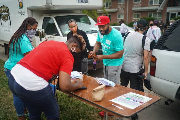 Corey Prince, the Wisconsin director for the Outreach Team, a political consulting firm, helped people register to vote Tuesday near where Jacob Blake was shot.