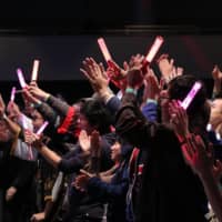 Visitors participate in a concert at Anime NYC in New York in 2019. | PAUL PETYO 