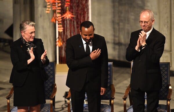 Ethiopia's Prime Minister Abiy Ahmed, center, receiving the Nobel Peace Prize in Oslo in December. Since then, his government has been accused of political repression.