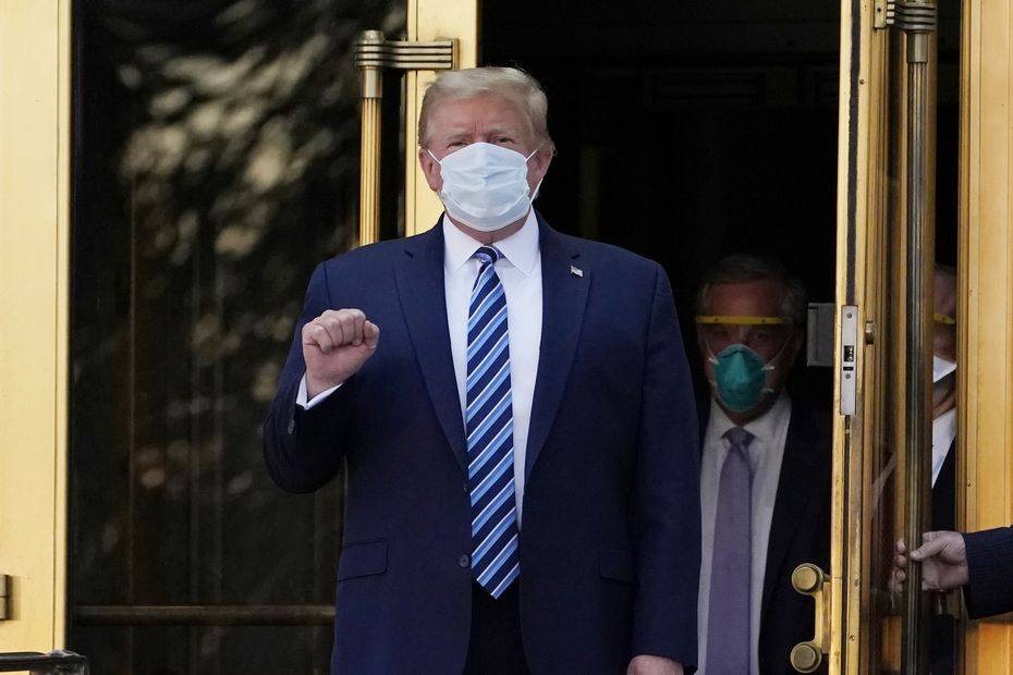 President Donald Trump walks out of Walter Reed National Military Medical Center to return to the White House after receiving treatments for Covid-19, Monday, Oct. 5, 2020, in Bethesda, Md. (AP Photo/Evan Vucci)