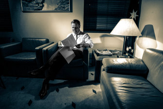 Treasurer Peter Costello looks over his twelfth budget late into the night before Budget Day in 2007. 