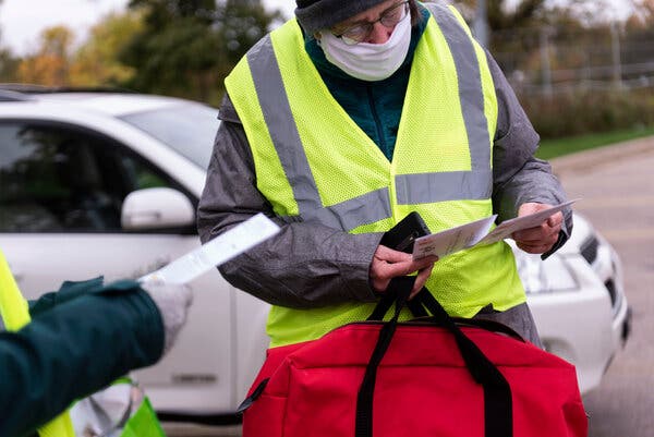 Julie Chase, a poll worker, collected and stored ballots received at Tenney Park in Madison.