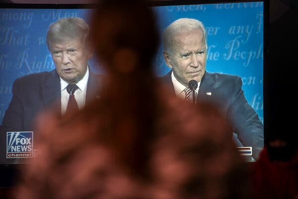 President Trump and Joseph R. Biden Jr. seen on a television in Lititz, Pa., during their debate on Sept. 29.