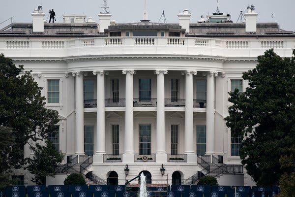 Workers prepare the South Lawn of the White House for President Trump’s first public event since being hospitalized for coronavirus.