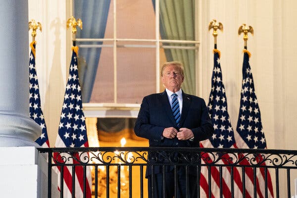 President Trump on the Truman Balcony of the White House on Monday after being discharged from Walter Reed National Military Medical Center.