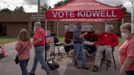 Rep. Keith Kidwell greets voters near an early voting site in Washington, North Carolina.