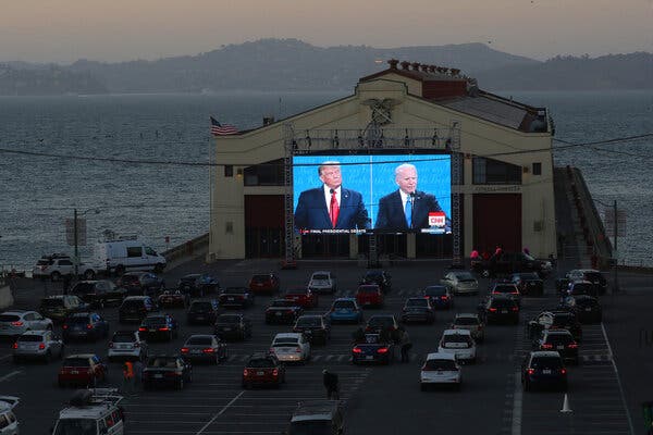 People watching the final presidential debate at a pier in San Francisco.